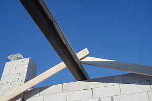 двухэтажный дом из газоблока цена под кровлю